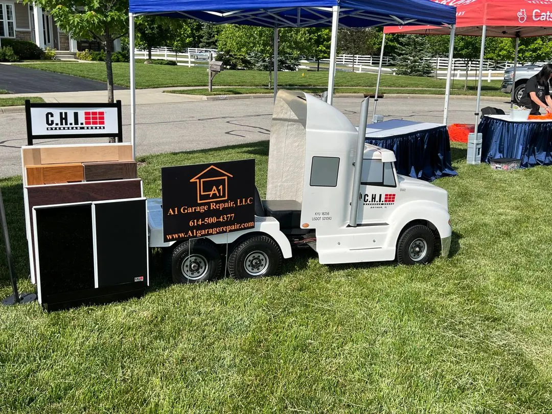 A1 Garage Repair booth with garage door samples at a community event